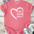 Pink t-shirt with 'Faith, Dogs, Beach' graphic design, perfect for casual summer outings.