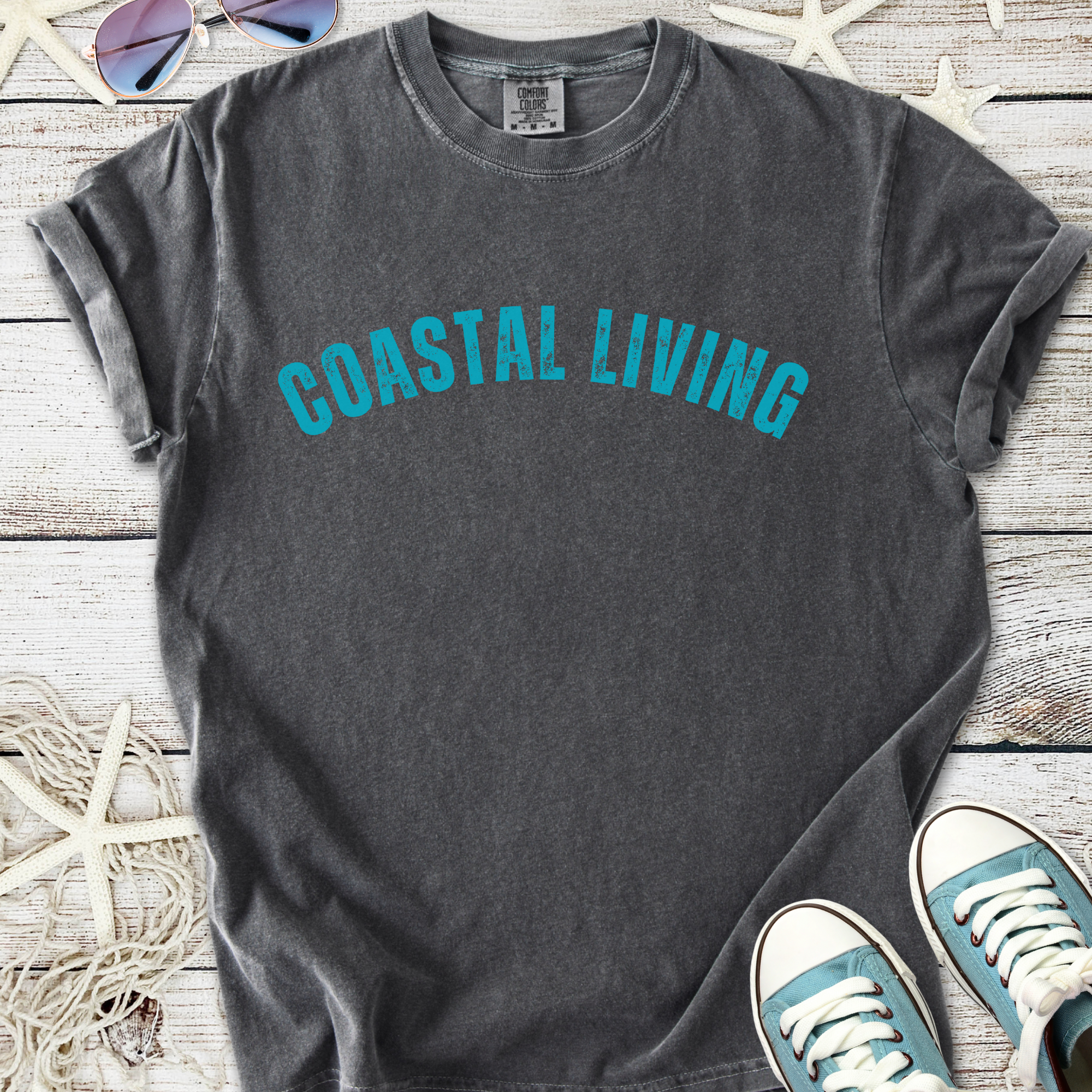 Gray Coastal Living t-shirt in soft cotton with turquoise graphic print, perfect for beach days.