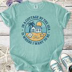 Light blue cotton graphic tee featuring beach cottage design and playful seaside elements.
