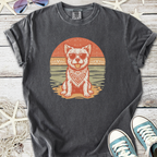 Cool graphic tee featuring a dog in sunglasses, orange and teal design on a dark gray shirt.