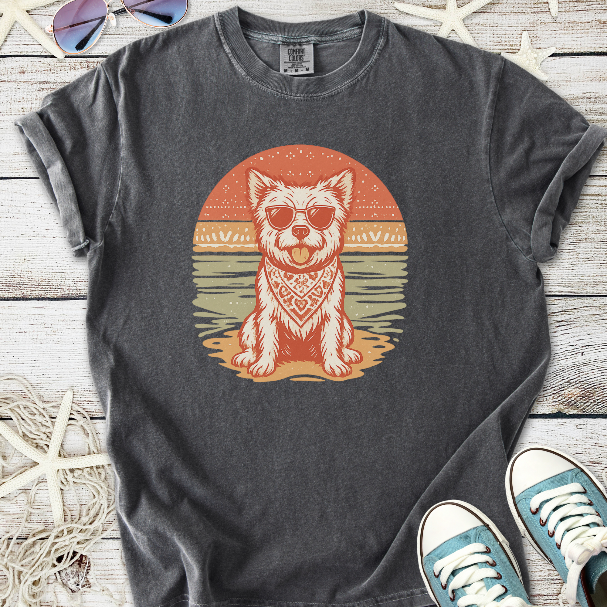 Cool graphic tee featuring a dog in sunglasses, orange and teal design on a dark gray shirt.