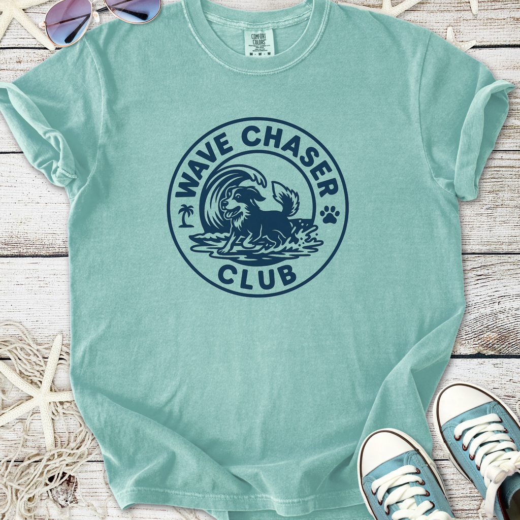 Light teal 'Wave Chaser Club' graphic t-shirt featuring a dog surfing design, perfect for beach lovers.