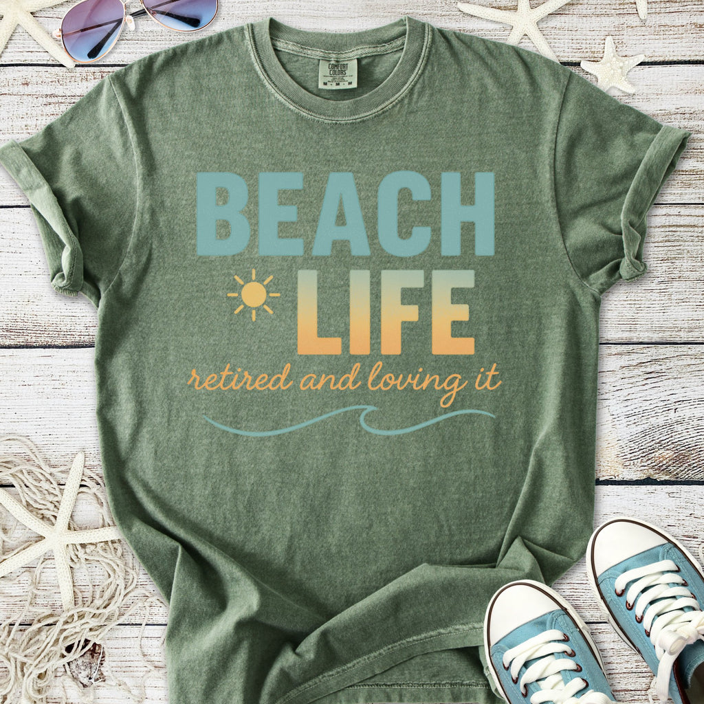 Olive green t-shirt with 'BEACH LIFE' print, perfect for retirees, made from soft, comfortable material.