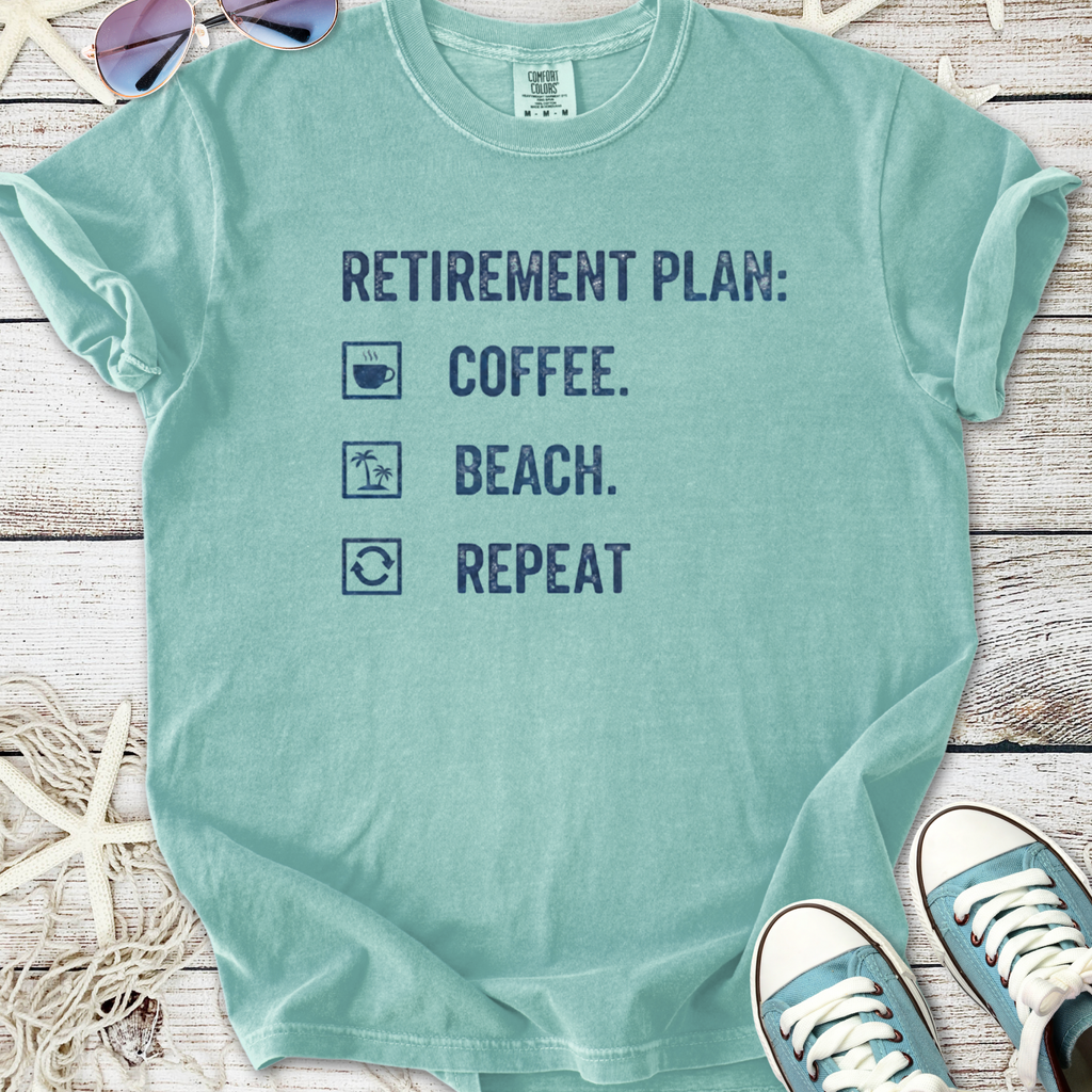 Light blue retirement plan t-shirt with coffee, beach, and repeat print, ideal for casual summer wear.