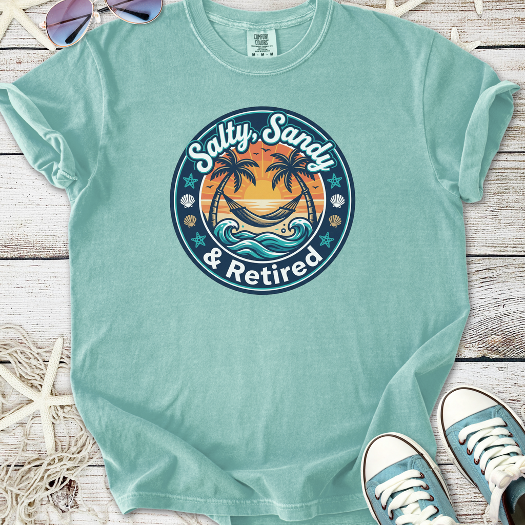 Light blue t-shirt featuring 'Salty, Sandy & Retired' graphic with palm trees and waves.