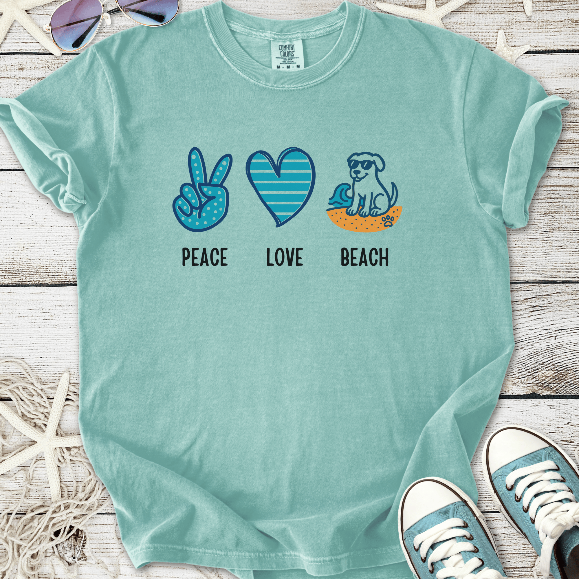 Aqua cotton t-shirt featuring 'Peace Love Beach' graphic with dog, perfect for casual summer wear.