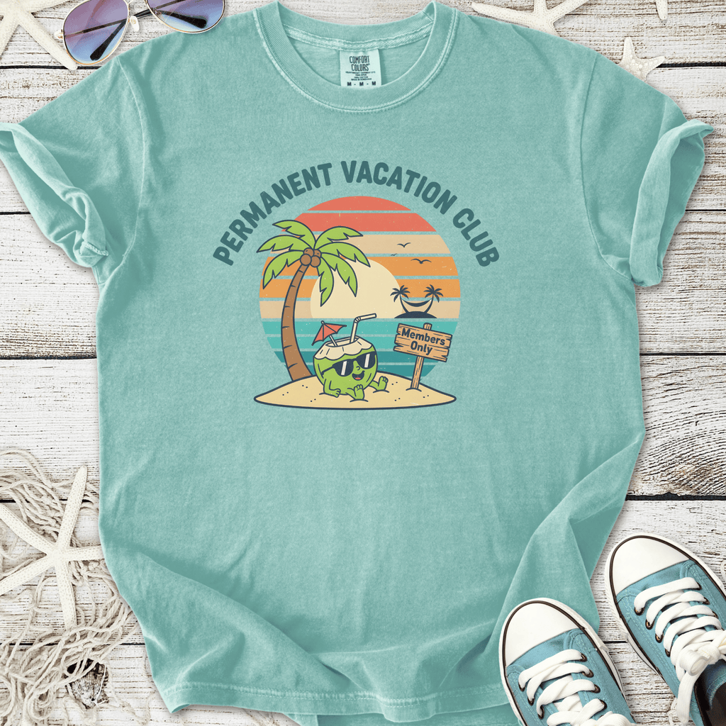 Light blue t-shirt featuring 'Permanent Vacation Club' graphic with tropical palm trees and a beach theme.