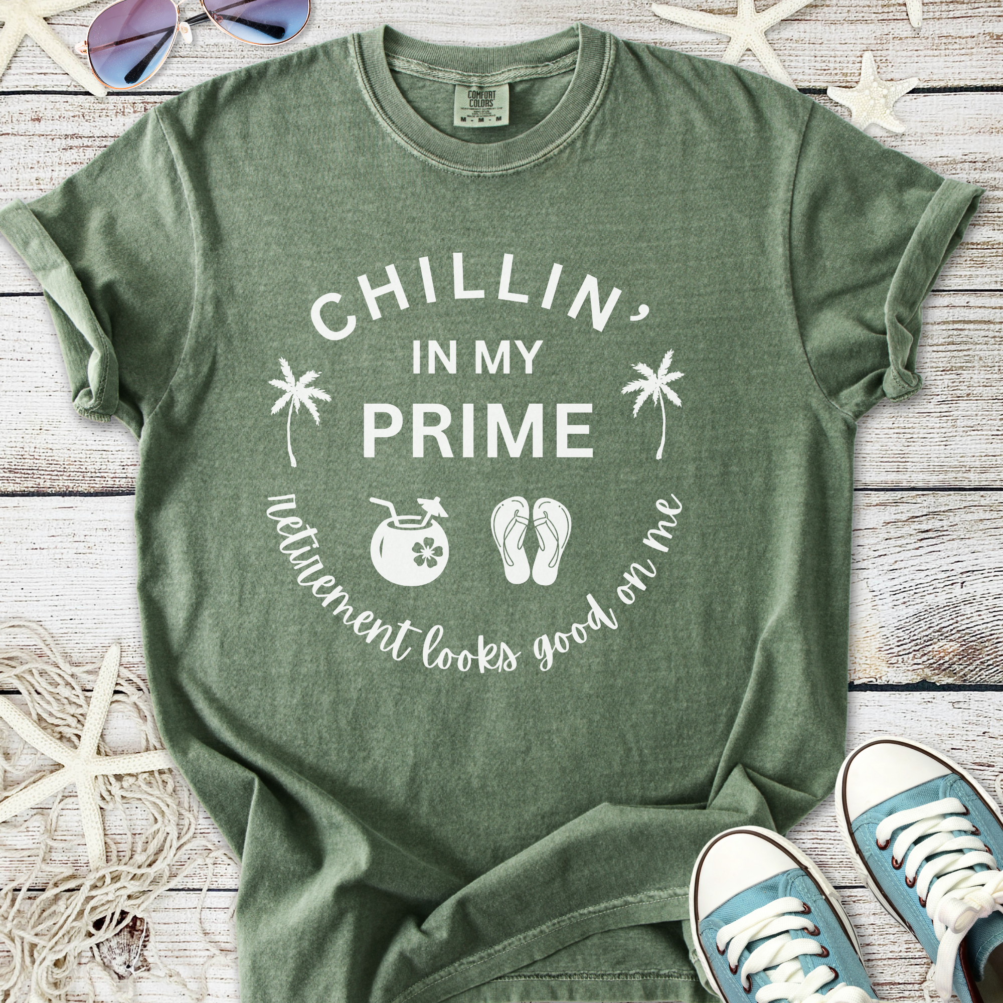 Olive green t-shirt with 'Chillin' in My Prime' graphic, perfect for retirement vibes.