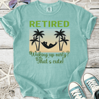 Mint green retired t-shirt with hammock and palm tree graphic, humorous retirement quote.