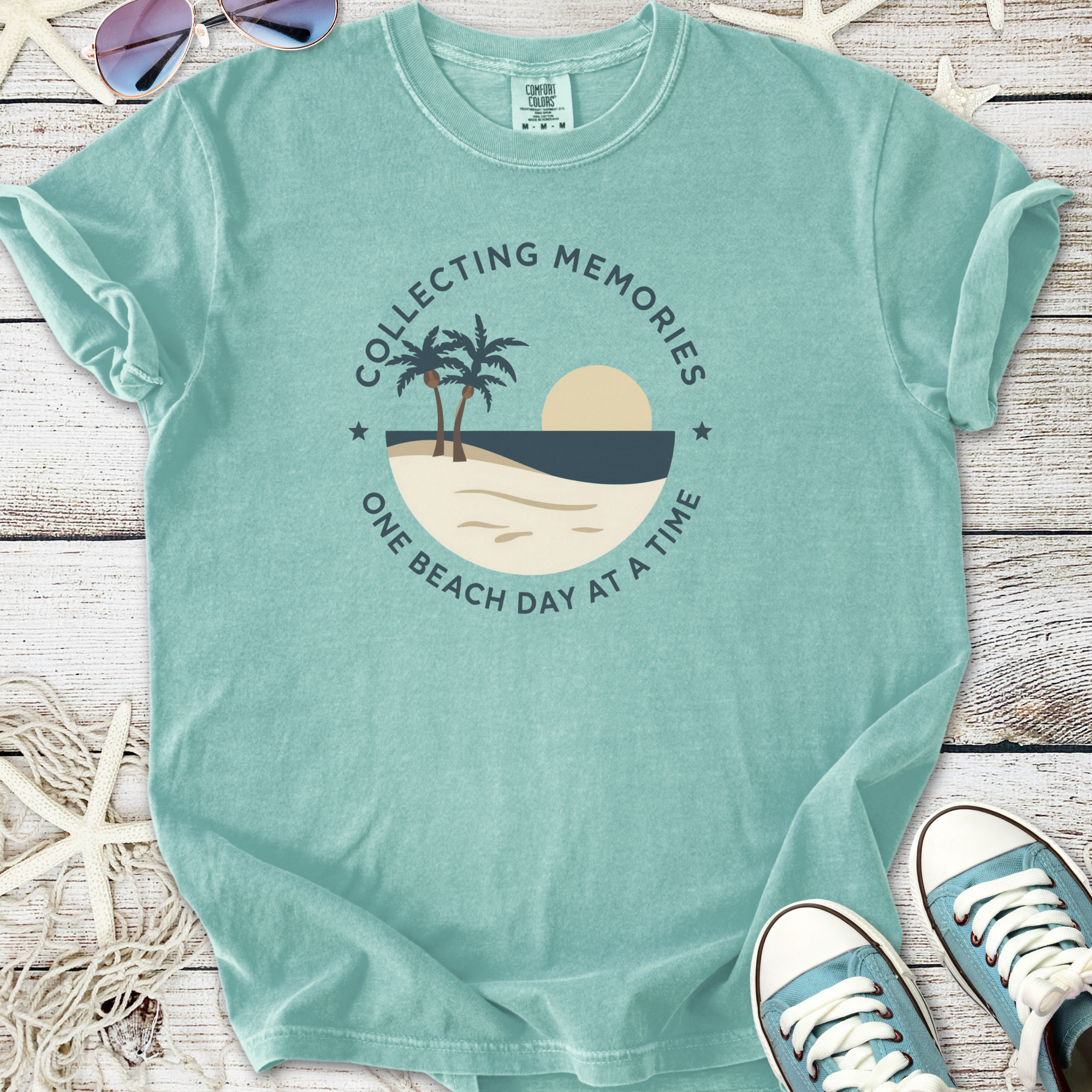 Mint green cotton t-shirt with beach-themed graphic and text, perfect for summer outings.