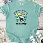 Light teal t-shirt with 'All you need is sunshine and a Dog' graphic, featuring a paw print design.