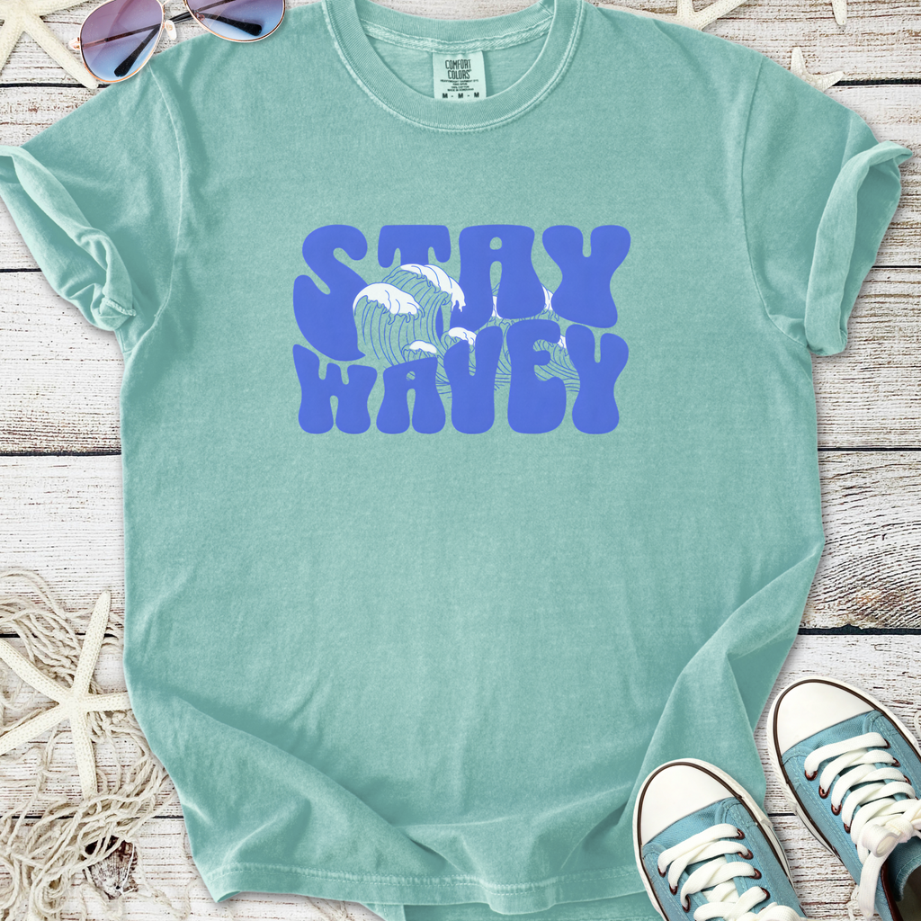 Mint green graphic t-shirt with 'Stay Wavey' design, perfect for casual beachwear.
