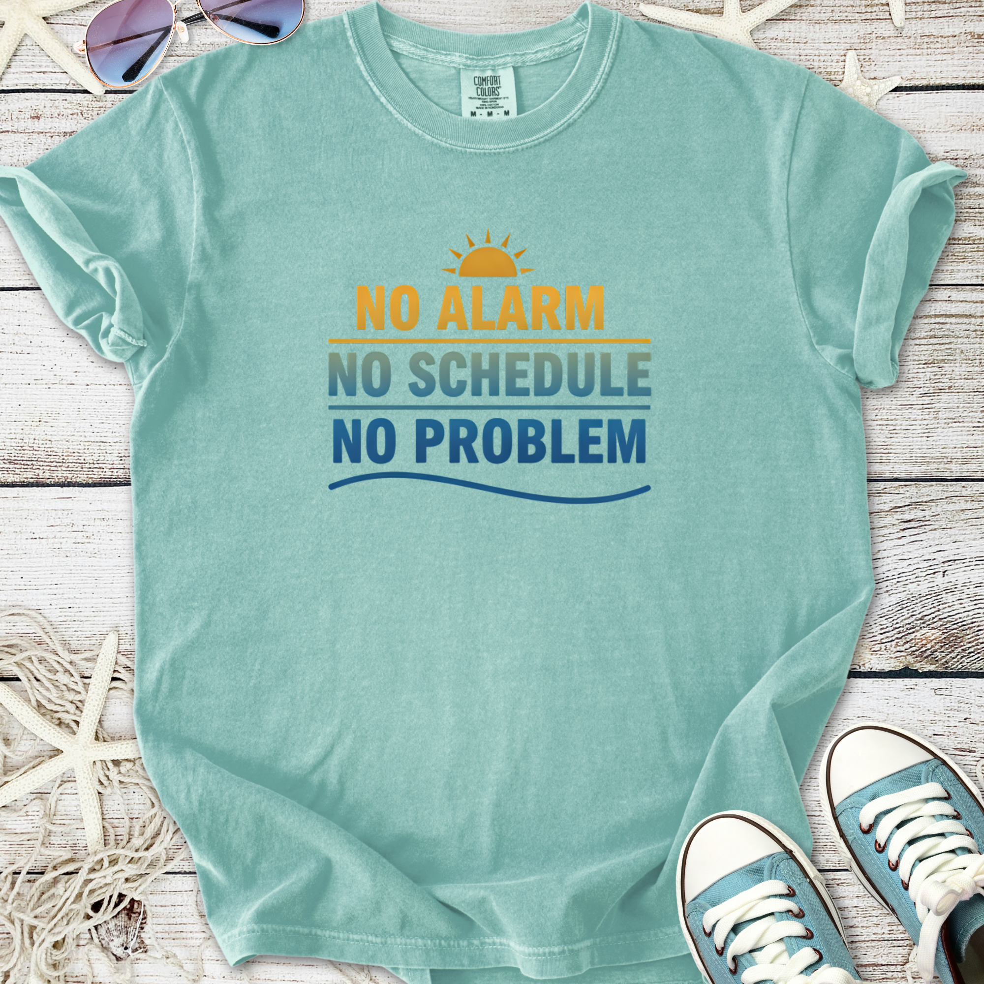 Light blue graphic t-shirt with 'No Alarm, No Schedule, No Problem' print, made from soft cotton.