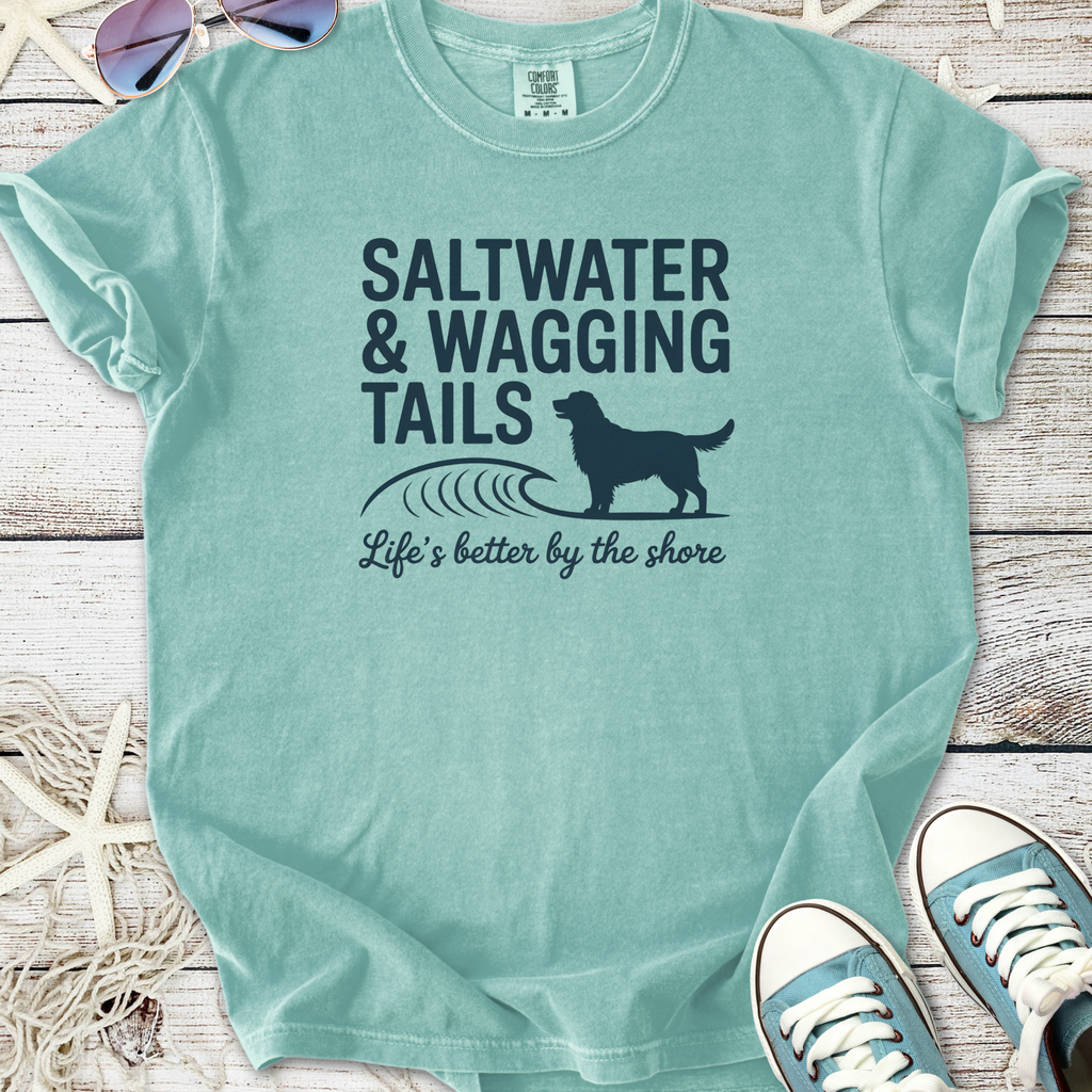 Mint green t-shirt with "Saltwater & Wagging Tails" graphic, perfect for dog lovers and beachgoers.