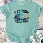 Light blue retired t-shirt with wave graphic and 'Waves > Work' text, made of soft cotton fabric.