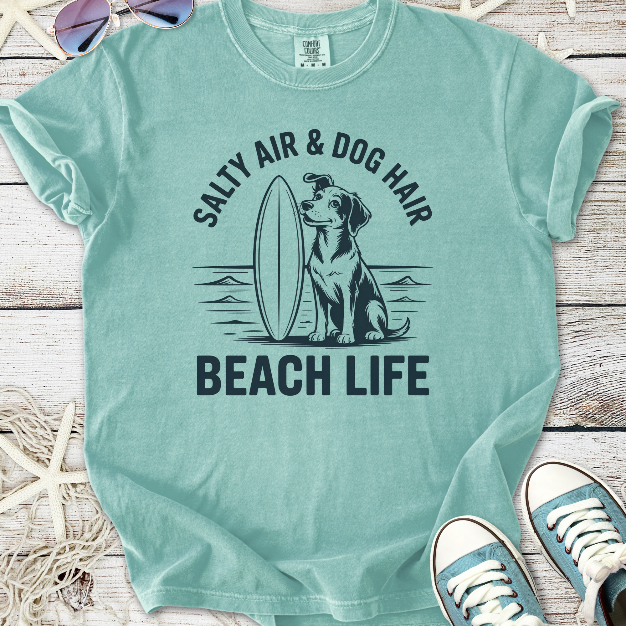 Mint green t-shirt with 'Salty Air & Dog Hair' and surfing dog graphic, perfect for beach lovers.