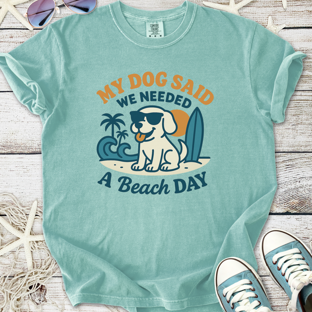 Light teal t-shirt with 'My Dog Said We Needed A Beach Day' graphic featuring a dog and surfboard.