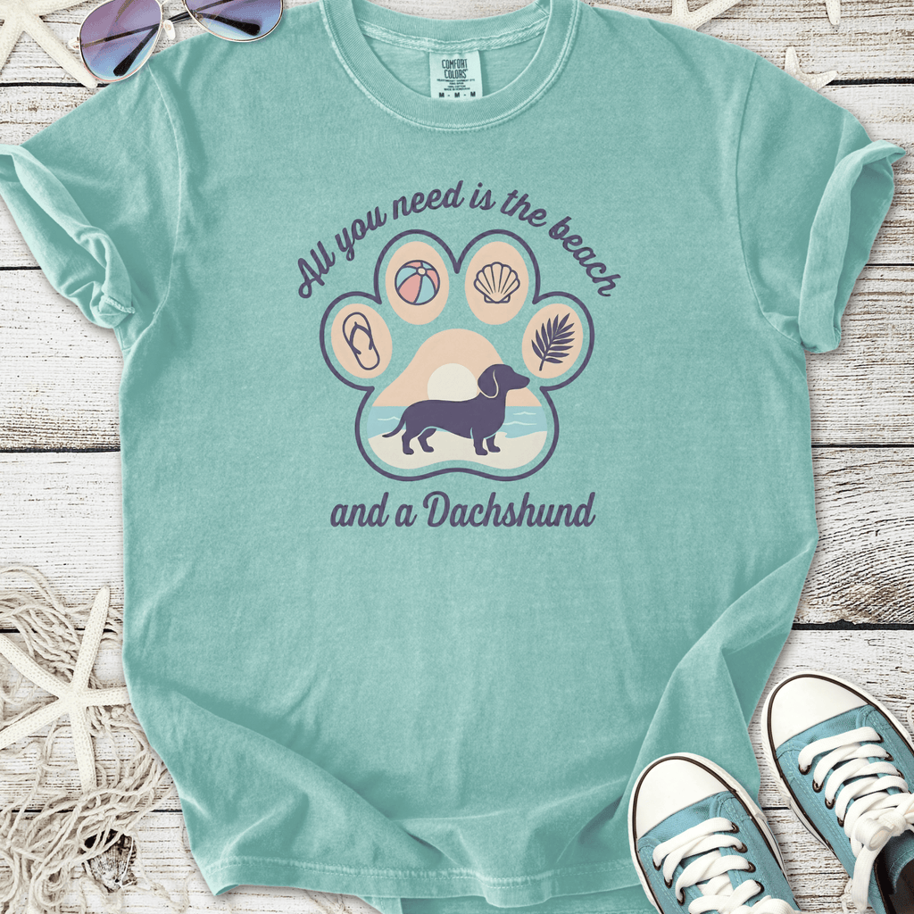Mint green t-shirt featuring a Dachshund and beach-themed graphic, made from soft cotton.