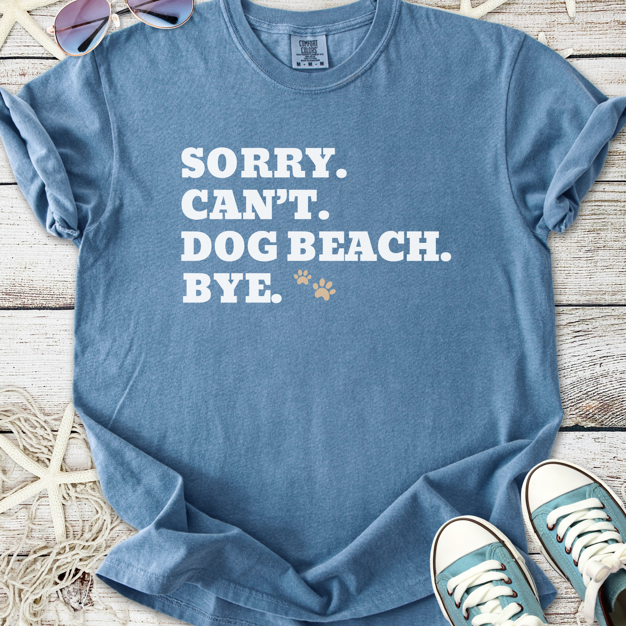 Light blue graphic tee with 'Sorry. Can't. Dog Beach. Bye.' printed in white.