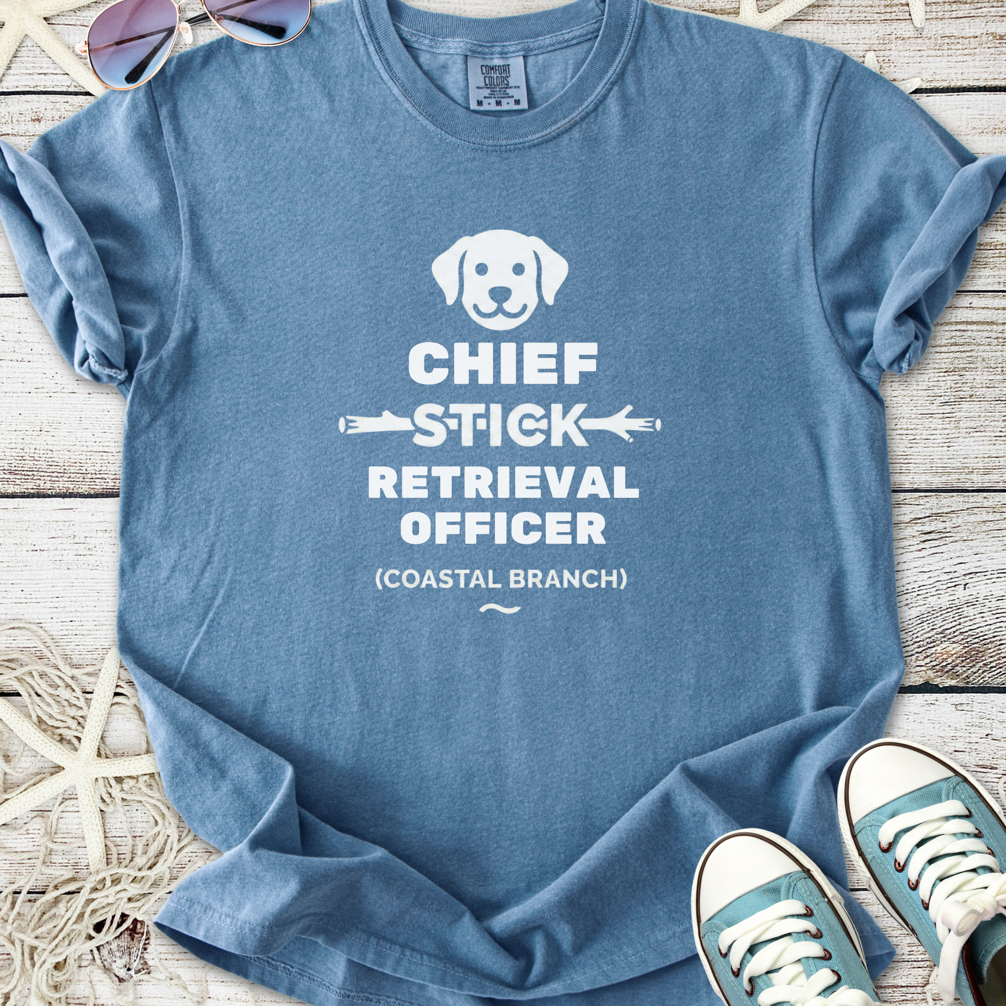 Blue cotton t-shirt with 'Chief Stick Retrieval Officer' print and dog graphic, perfect for dog lovers.