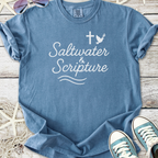 Blue faith based beach themed t-shirt with cross, dove, and ‘Saltwater & Scripture’ text