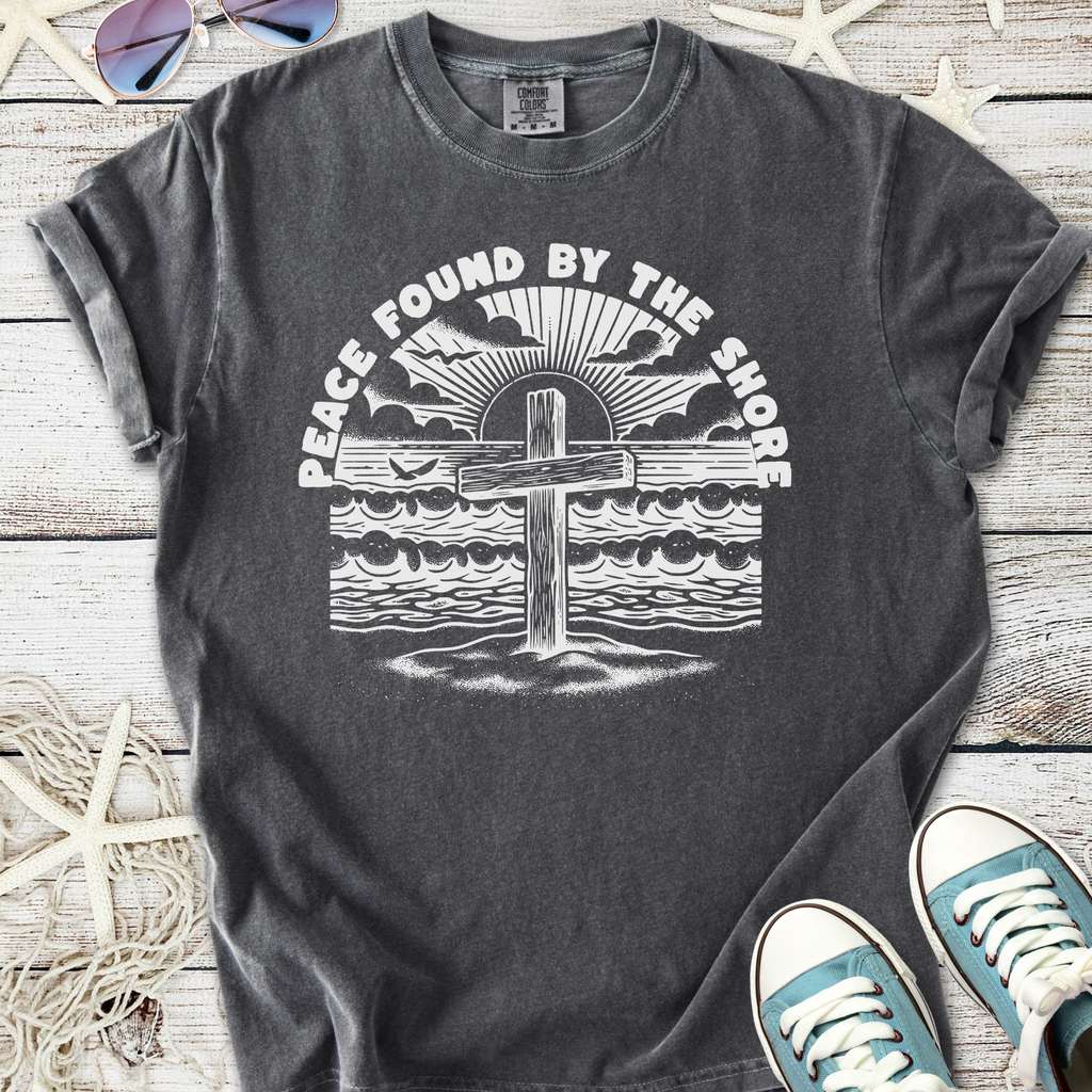 Gray cotton t-shirt with 'Peace Found By The Shore' graphic, perfect for beach lovers and casual wear.