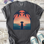 Graphite gray T-shirt featuring a dog silhouette against a sunset with palm trees.