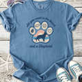 Blue unisex t-shirt with a playful design featuring a German Shepherd, beach elements, and fun text.