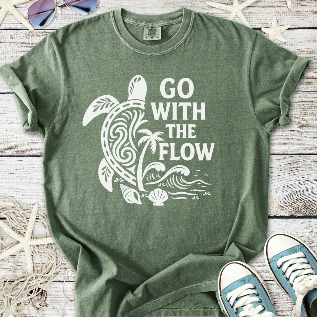 Olive green t-shirt with turtle graphic and 'GO WITH THE FLOW' text, made from soft cotton material.
