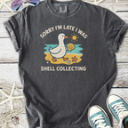 Funny gray T-shirt with a duck graphic saying 'Sorry I'm late I was shell collecting'