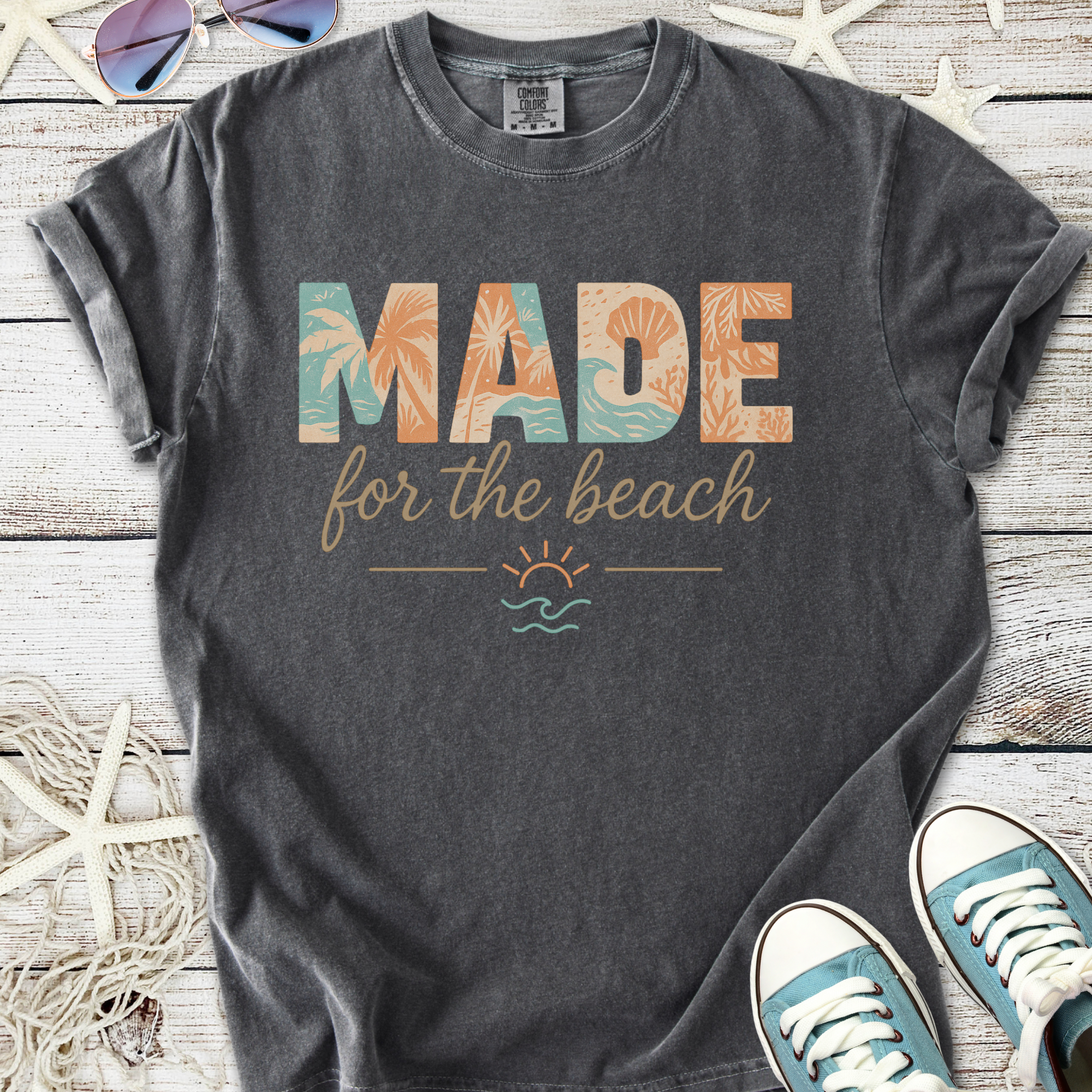 Charcoal gray t-shirt with 'MADE for the beach' design, featuring tropical graphics and a casual fit.