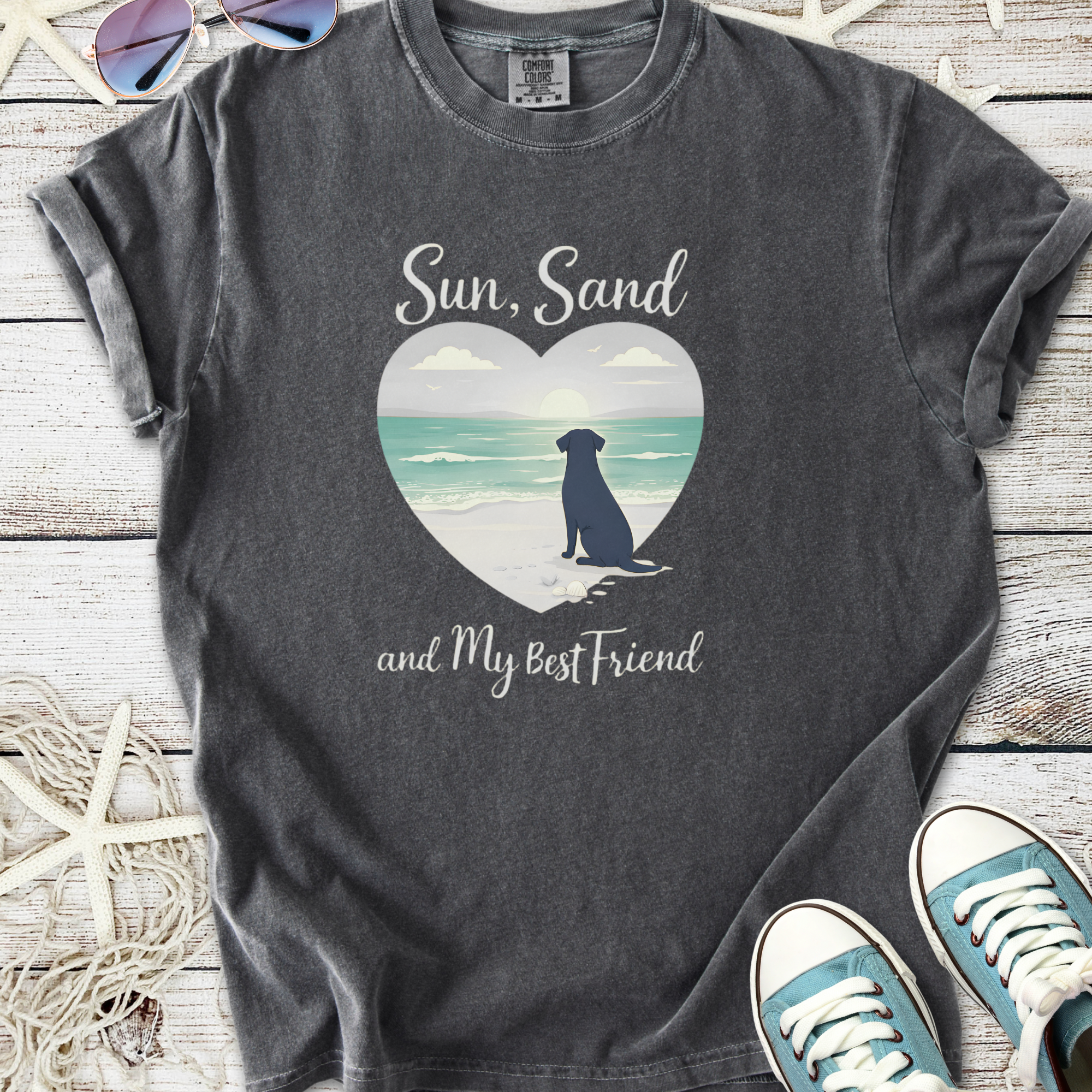 Charcoal graphic tee featuring a beach scene with a dog, text 'Sun, Sand and My Best Friend', casual style.