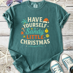 Teal cotton Christmas t-shirt featuring 'Have Yourself a Sandy Little Christmas' print with holiday graphics.