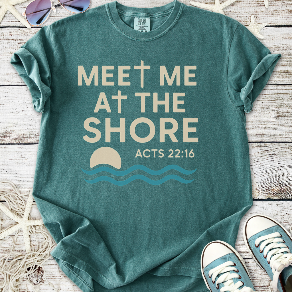 Teal graphic tee with 'Meet Me at the Shore' design and Acts 22:16 verse, made of soft cotton material.