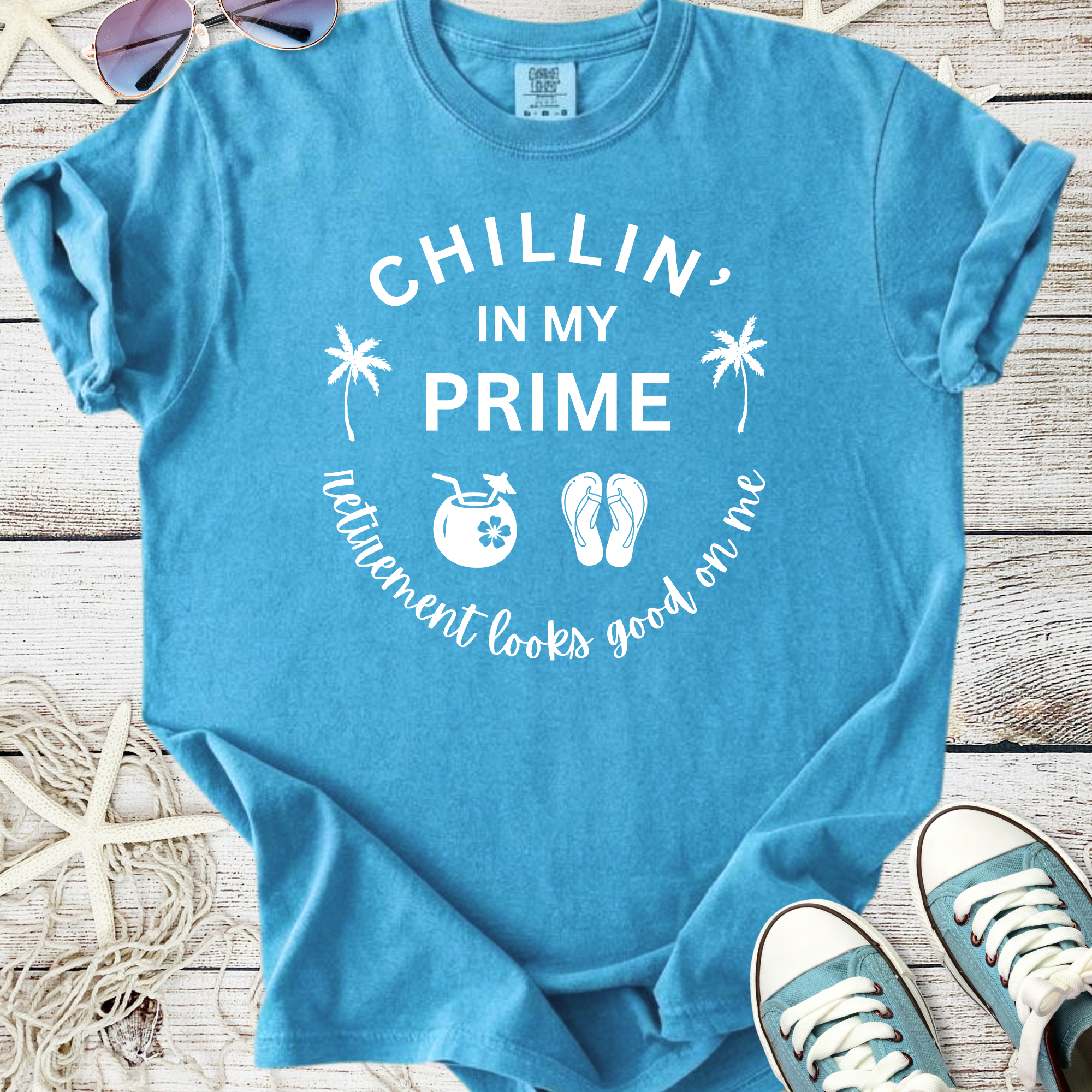 Light blue graphic tee featuring 'Chillin' in My Prime' print, perfect for relaxed retirement vibes.