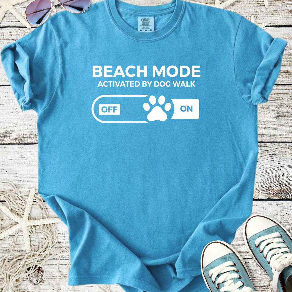 Light blue cotton t-shirt with 'Beach Mode Activated by Dog Walk' graphic, perfect for dog lovers.
