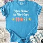 Blue cotton t-shirt with 'Life's Better in Flip Flops' graphic, perfect for summer wear.