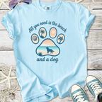 Light blue unisex t-shirt featuring a beach and dog graphic, perfect for summer outings.