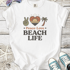White t-shirt featuring 'Peace-Love Beach Life' graphic with palm tree and sunset design.