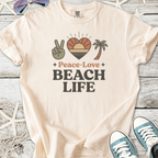 Cream cotton t-shirt with 'Peace-Love Beach Life' graphic, featuring palm tree and sunset design.