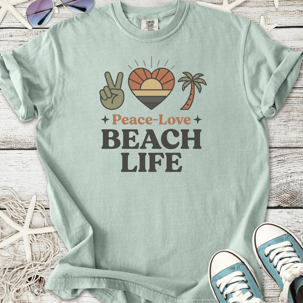 Mint green graphic tee featuring 'Peace-Love Beach Life' with palm tree and sunset design.