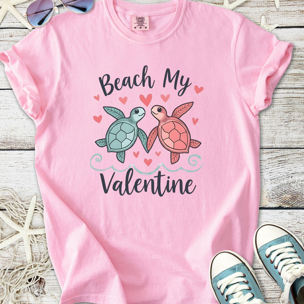 Cute pink t-shirt featuring turtles and 'Beach My Valentine' graphic, perfect for romantic beach outings.