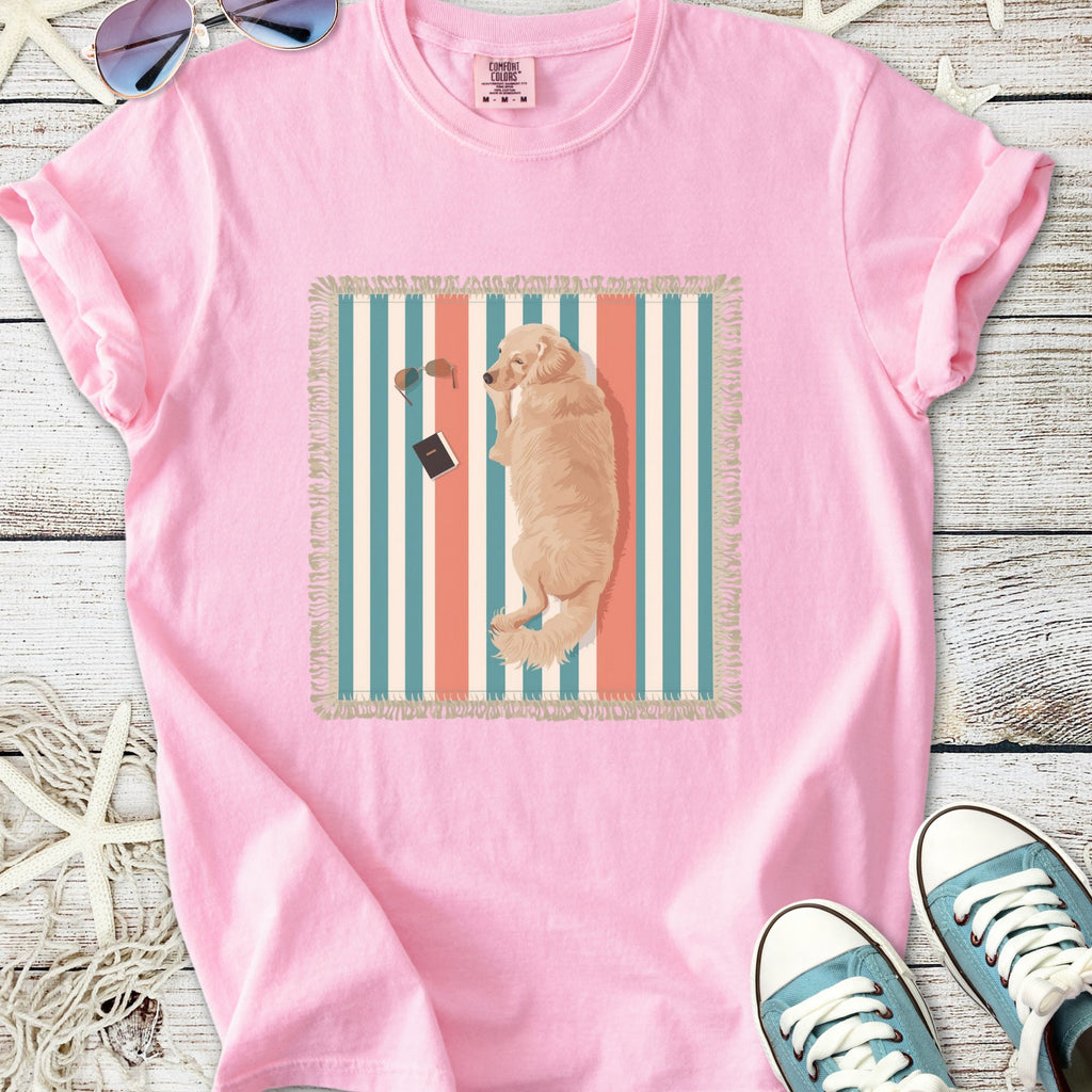 Cute pink t-shirt featuring a golden retriever graphic on a striped background, perfect for dog lovers.