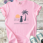 Pink cotton t-shirt featuring dog, palm tree, and 'Good Vibes Only' graphic design.