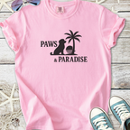Light pink t-shirt featuring 'Paws & Paradise' graphic with a dog and palm tree design.