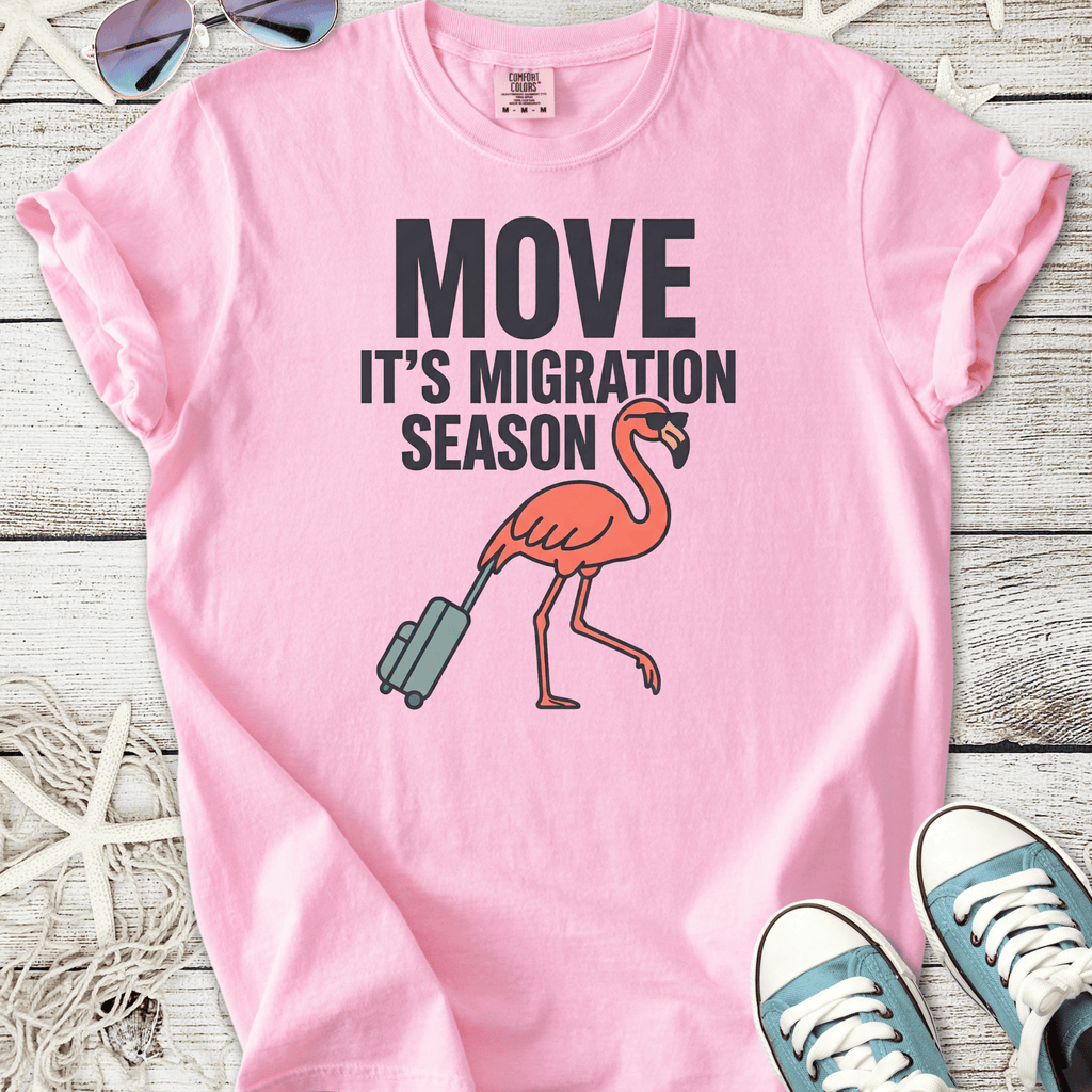 Pink cotton t-shirt featuring a flamingo and migration season graphic design.