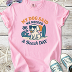 Pink graphic t-shirt featuring a dog in sunglasses with the phrase 'My Dog Said We Needed A Beach Day'.