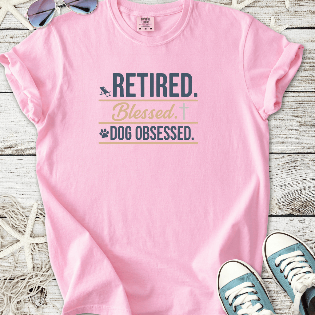 Pink t-shirt with 'Retired. Blessed. Dog Obsessed.' text, perfect for dog lovers.