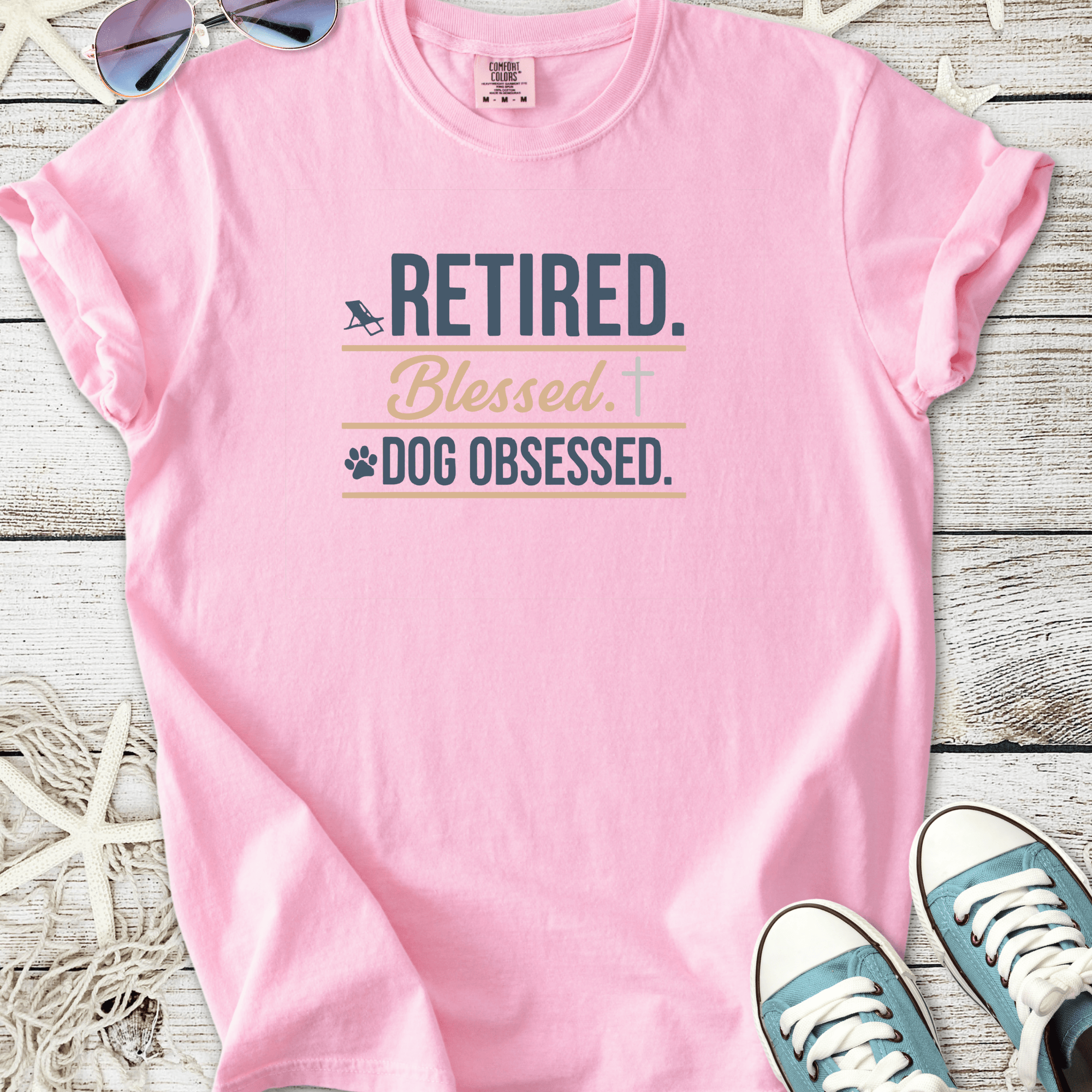 Pink t-shirt with 'Retired. Blessed. Dog Obsessed.' text, perfect for dog lovers.