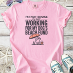 Pink graphic t-shirt with humorous text about working for dog's beach fund, casual style.